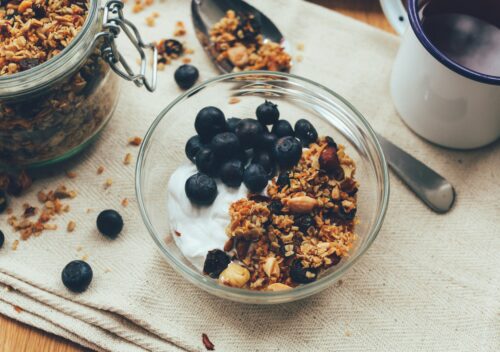 small bowl of yogurt, granola, and blueberries