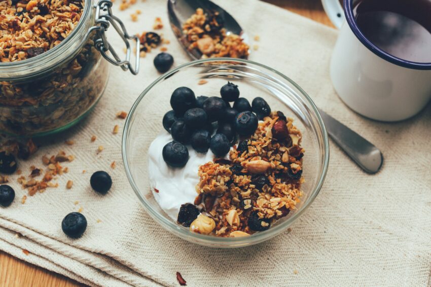 small bowl of yogurt, granola, and blueberries